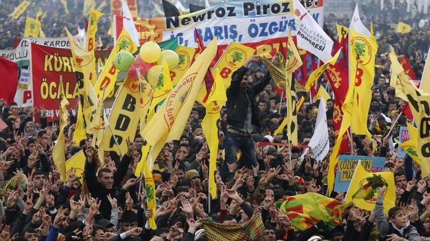 Demonstrators wave pro-Kurdish Peace and Democracy Party flags during a rally to celebrate the spring festival of Newroz in Istanbul March 17, 2013. REUTERS/Murad Sezer (TURKEY - Tags: POLITICS CIVIL UNREST) - RTR3F4BU