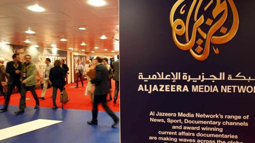 The logo of  Al Jazeera Media Network is seen at the MIPTV, the International Television Programs Market, event in Cannes April 2, 2012.         REUTERS/Eric Gaillard (FRANCE - Tags: ENTERTAINMENT BUSINESS) - RTR308Z4