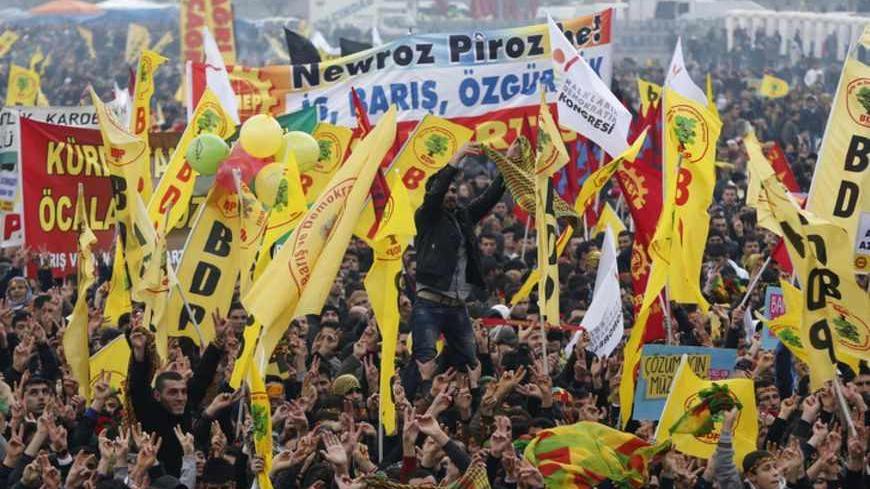 Demonstrators wave pro-Kurdish Peace and Democracy Party flags during a rally to celebrate the spring festival of Newroz in Istanbul March 17, 2013. REUTERS/Murad Sezer (TURKEY - Tags: POLITICS CIVIL UNREST) - RTR3F4BU