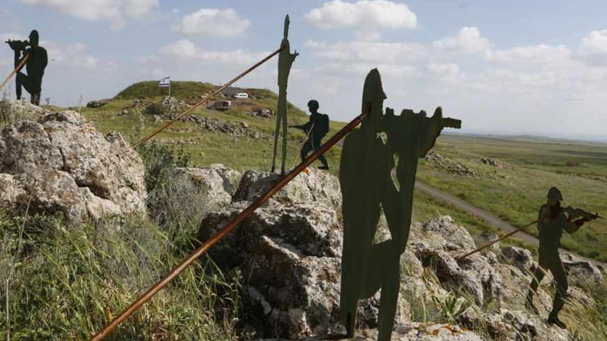 Sculptures are seen on a hill near the Israeli Syrian border in the Israeli-occupied Golan Heights March 24, 2013. Israel said it fired into Syria on Sunday and destroyed a machinegun position in the Golan Heights from where shots had been fired at Israeli soldiers in a further spillover of the Syrian civil war along a tense front. Israel captured the Golan Heights in the 1967 Middle East war and annexed it in 1981 in a move not recognized internationally. REUTERS/Baz Ratner (MILITARY POLITICS) - RTXXW5G