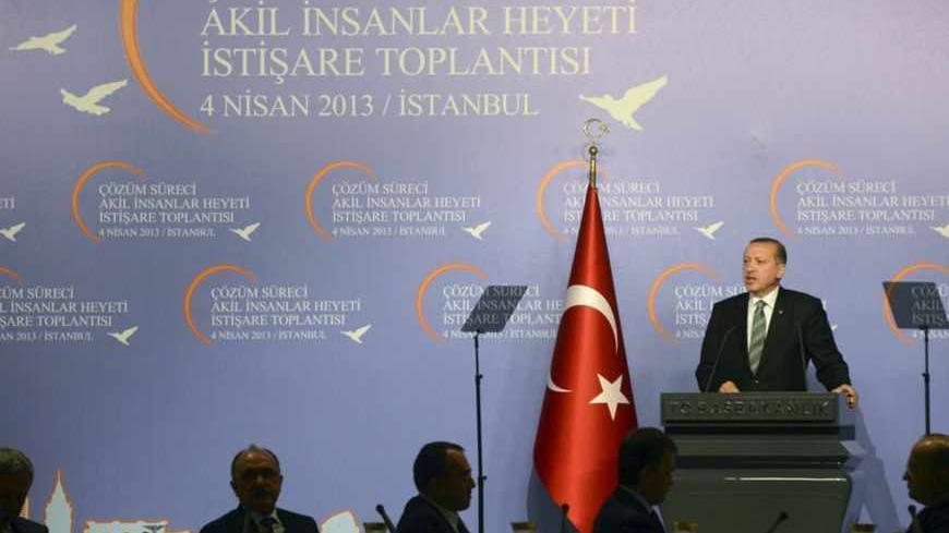 Turkey's Prime Minister Tayyip Erdogan makes his address during a meeting with the 'wise people' commission in Istanbul April 4, 2013. Erdogan chaired an inaugural meeting of the 'wise people' commission, who will be consulted on a peace process with Kurdish militants. The commission is made up of academics, journalists and performing artists, and established by the government to promote the peace process nationwide. REUTERS/Metin Pala/Pool (TURKEY - Tags: POLITICS CIVIL UNREST) - RTXY8E6