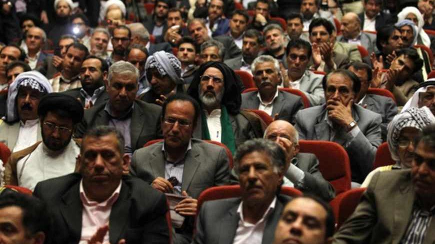 Iranians attend a ceremony where former top nuclear negotiator Hassan Rowhani announced his candidacy for the upcoming presidential election in Tehran on April 11, 2013. The June 14 election will be followed closely four years after Mahmoud Ahmadinejad's re-election for a second term sparked a wave of violent protests that were suppressed by the regime with deadly force. AFP PHOTO/ATTA KENARE        (Photo credit should read ATTA KENARE/AFP/Getty Images)