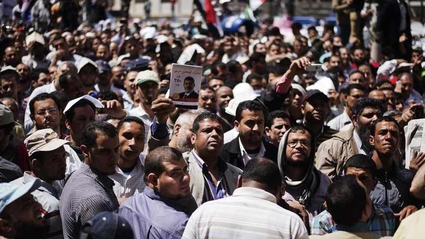 Thousands of Muslim Brotherhood supporters protest in front of the High Court in Cairo demanding a purge in the Egyptian judicial system on April 19, 2013.  AFP PHOTO/GIANLUIGI GUERCIA        (Photo credit should read GIANLUIGI GUERCIA/AFP/Getty Images)