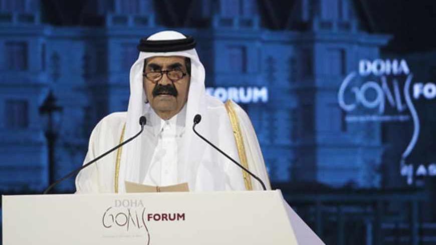 Qatar's Emir Sheikh Hamad bin Khalifa al-Thani talks during the official opening ceremony of the Doha GOALS forum in Doha December 11, 2012.  REUTERS/Fadi Al-Assaad (QATAR - Tags: SPORT POLITICS) - RTR3BG1Z