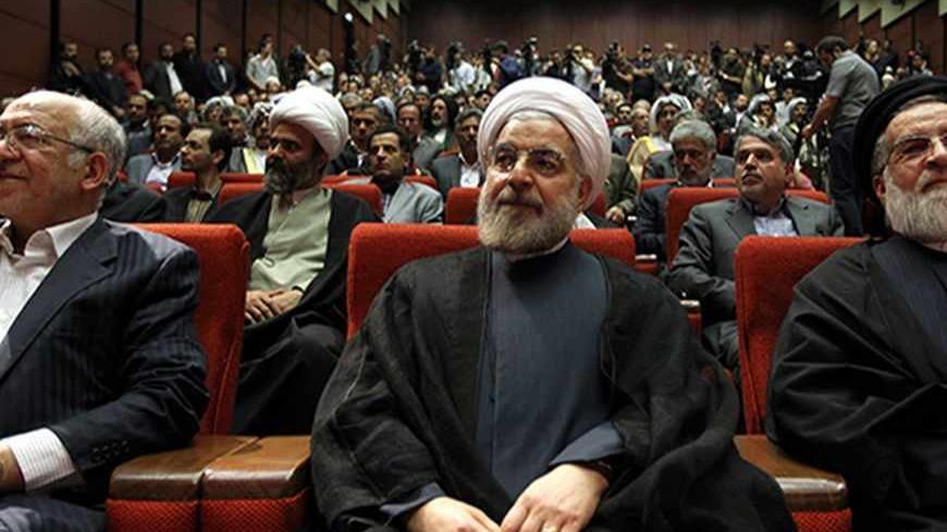 Iran's former top nuclear negotiator Hassan Rowhani (C) attends a ceremony where he announced his candidacy for the upcoming presidential election in Tehran on April 11, 2013. The June 14 election will be followed closely four years after Mahmoud Ahmadinejad's re-election for a second term sparked a wave of violent protests that were suppressed by the regime with deadly force. AFP PHOTO/ATTA KENARE        (Photo credit should read ATTA KENARE/AFP/Getty Images)