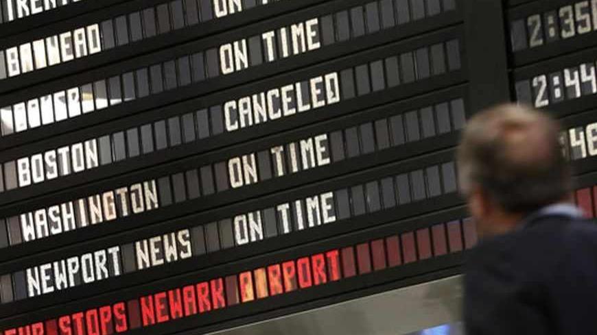 The train schedule board shows train service to Boston canceled at New York's Penn Station April 19, 2013. All mass transit, including subways, buses, commuter rail and Amtrak trains, travelling to and from Boston have been shut down as the manhunt continues for Dzhokar Tsarnaev, the remaining suspect in the Boston Marathon bombings. Police killed one suspect in the Boston Marathon bombing, Tamerlan Tsarneav, in a shootout and mounted house-to-house searches for the second man, his brother Dzhokar Tsarnaev,