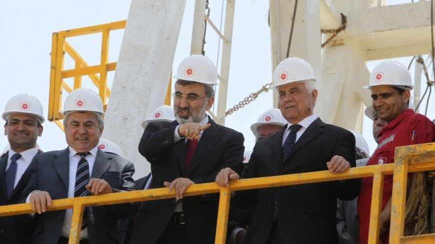 Turkey's Energy Minister Taner Yildiz (C) and Turkish Cypriot leader Dervis Eroglu (2nd R) attend a ground-breaking ceremony near Famagusta April 26, 2012. Turkey on Thursday began drilling for oil and gas in breakaway northern Cyprus, threatening to inflame tensions with Greek Cypriots and undermine UN-backed efforts to reunite the divided island, key to Ankara's aspirations to join the European Union. At a ceremony in northeast Cyprus, the state-run Turkish Petroleum Corporation (TPAO) launched onshore dr