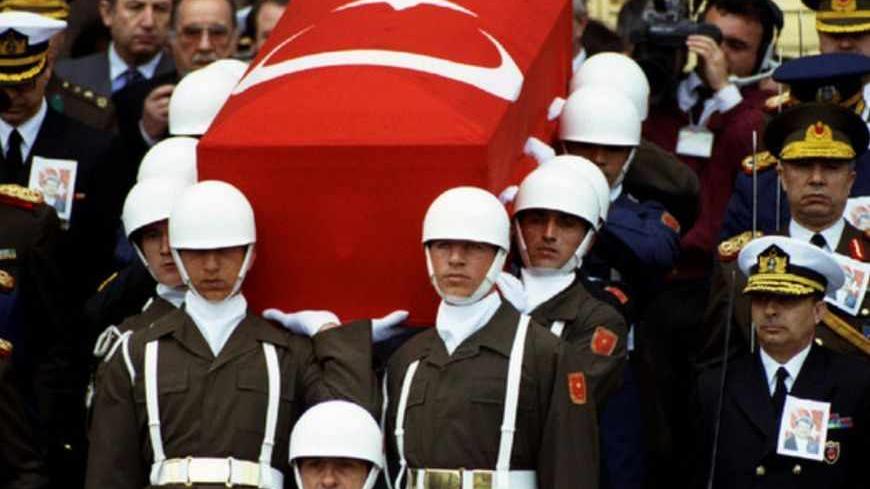 Presidential honour guard carry coffin of President Turgut Ozal as Turkish generals with drawn swords accompany them during a funeral procession in Ankara April 21. Ozal died of a heart attack on April 17 - RTXF0JV