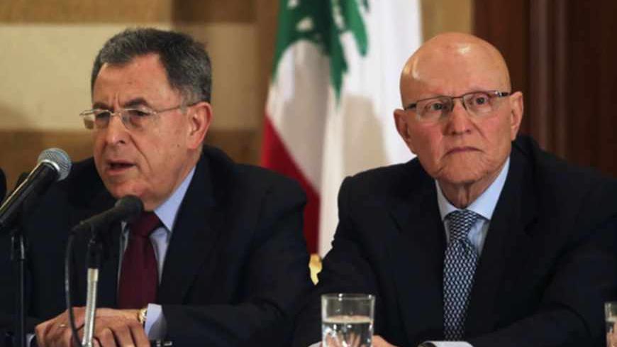 Lebanese former prime minister Fouad Siniora (L) speaks during a meeting for pro-Western March 14 political coalition as former minister Tammam Salam looks on, in Beirut April 4, 2013. Lebanese politician Tamam Salam, a former minister from a prominent Sunni Muslim dynasty, emerged as a potential new prime minister on Thursday after he was endorsed by the country's pro-Western March 14 political coalition. REUTERS/Mohamed Azakir  (LEBANON - Tags: POLITICS) - RTXY8EP