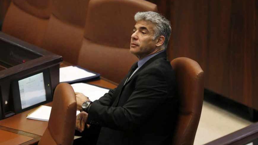 Israel's Finance Minister Yair Lapid attends the opening of the summer session of the Knesset, the Israeli parliament, in Jerusalem April 22, 2013. Lapid is seeking spending cuts of 18 billion shekels ($5 billion) and tax increases of 5 billion shekels as part of the 2013-2014 budget framework, a spokeswoman for Lapid said on Monday. REUTERS/Baz Ratner (JERUSALEM - Tags: POLITICS BUSINESS) - RTXYVXB