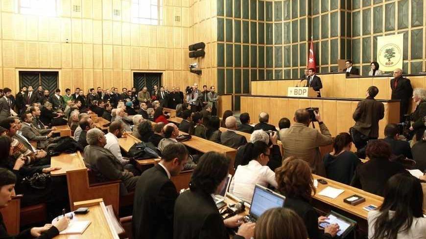 Peace and Democracy Party (BDP) Co-chairman Selahattin Demirtas addresses members of parliament from his party and audience members during a meeting at the Turkish parliament in Ankara January 8, 2013.   REUTERS/Umit Bektas (TURKEY - Tags: POLITICS) - RTR3C7GU