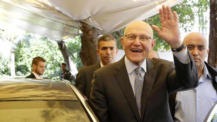 Lebanese former minister Tammam Salam gestures to his supporters in front of his house while going to the presidential palace in Baabda, Beirut April 6, 2013. Shi'ite militant group Hezbollah, its allies and pro-Western rivals on Friday backed Sunni politician Tammam Salam to be Lebanon's new prime minister, handing him an overwhelming parliamentary endorsement to form a government.  REUTERS/Mohamed Azakir (LEBANON - Tags: POLITICS) - RTXYAJC