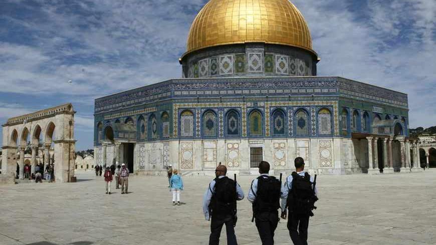Israeli police officers walk in front of the Dome of the Rock, on the compound known to Muslims as al-Haram al-Sharif and to Jews as Temple Mount, in Jerusalem's Old City March 17, 2010. A surge in Palestinian-Israeli violence on the streets of Jerusalem and the West Bank is a sign of broader instability ahead unless the United States can quickly restore faith in the peace process. Clashes this month indicate the rising tension between Palestinians and a right-wing Israeli government which has incensed Pale