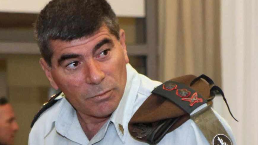 Israel's army chief Lieutenant-General Gabi Ashkenazi takes a seat before testifying at a state-appointed inquiry into the Israeli naval raid on a Gaza aid flotilla, in Jerusalem, August 11, 2010. Ashkenazi acknowledged on Wednesday that his troops were not ready for the violent resistance encountered when they boarded the Gaza-bound aid ship and ended up killing nine pro-Palestinian activists. REUTERS/Gali Tibbon/Pool (JERUSALEM - Tags: POLITICS CIVIL UNREST MILITARY) - RTR2H8JS