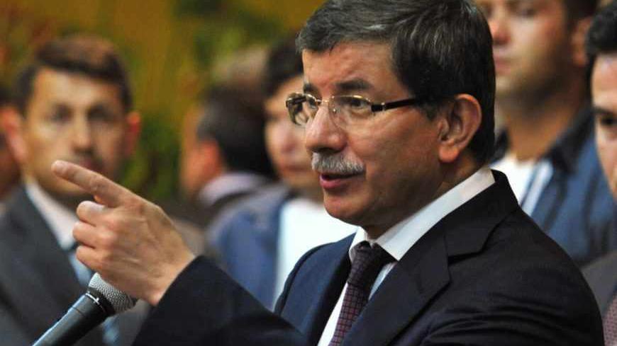 Turkish Foreign Minister Ahmet Davutoglu speaks during a news conference in the rebel stronghold of Benghazi July 3, 2011. Turkey pledged $200 million in aid for Libya's rebel Transitional National Council and said it was time for leader Muammar Gaddafi to leave Libya.   REUTERS/Esam Al-Fetori (LIBYA - Tags: POLITICS) - RTR2OFV1