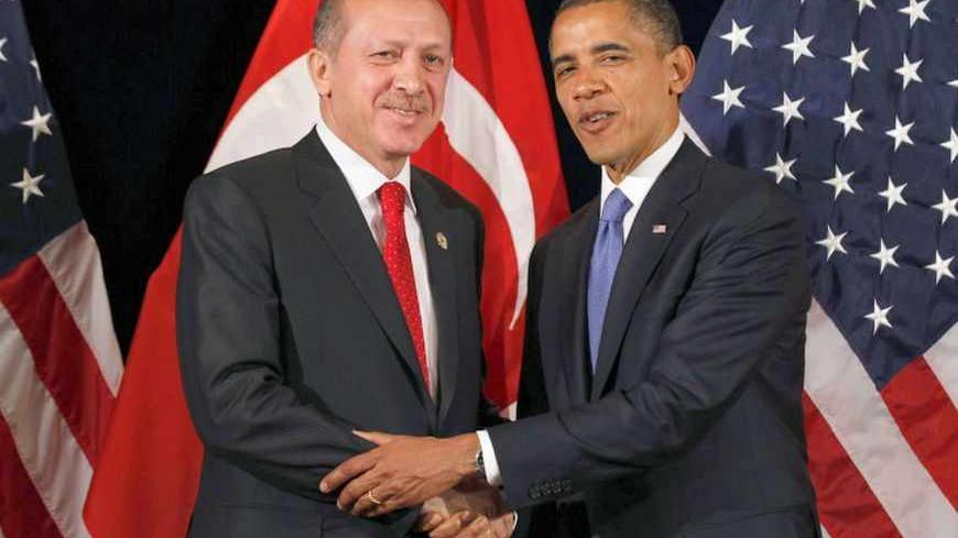 U.S. President Barack Obama (R) shakes hands with Turkey's Prime Minister Tayyip Erdogan after a bilateral meeting in Seoul March 25, 2012. Both leaders will attend the 2012 Nuclear Security Summit in Seoul on Monday. REUTERS/Larry Downing  (SOUTH KOREA - Tags: POLITICS MILITARY) - RTR2ZUE9