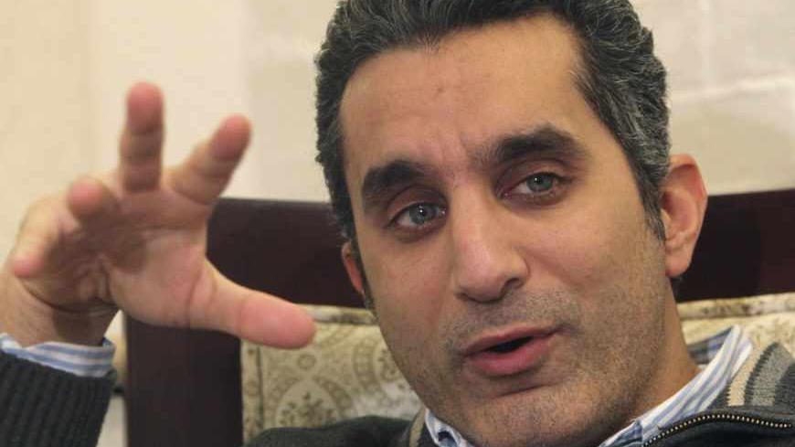 Popular Egyptian satirist Bassem Youssef gestures as he talks during an interview with Reuters in Cairo, January 15, 2013. REUTERS/Asmaa Waguih (EGYPT - Tags: POLITICS ENTERTAINMENT PROFILE) - RTXYIZ3