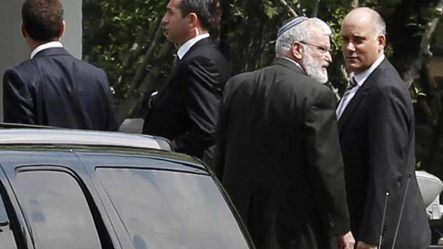 An Israeli delegation arrives at the Turkish Foreign Ministry to hold talks on compensation for families of victims killed in a 2010 naval raid on Turkish-led humanitarian-aid convoy to Gaza, in Ankara April 22, 2013. REUTERS/Umit Bektas (TURKEY - Tags: POLITICS) - RTXYVKG