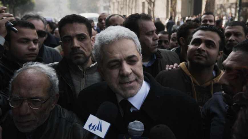 Former Egyptian president candidate Hamdeen Sabahi (C) talks to the media after attending the funeral of killed Egyptian activists Amro Saad and Mohammed al-Guindi outside Omar Makram Mosque in Cairo's Tahrir Square on February 4, 2013. Saad died in clashes during anti-government protests on February 1, while Guindi, 28, went missing last month after joining protests demanding change on the second anniversary of Egypt's uprising against former president Hosni Mubarak and then slipped into a coma following d
