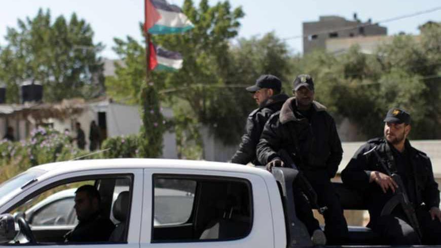 Hamas security men stand guard on the border between Gaza city and Israel to prevent any Palestinian collaborators from escaping to Israel on April 10, 2013. Hamas accused Western and Arab spy agencies of operating in the Gaza Strip and said it had a list of alleged collaborators. AFP PHOTO/MAHMUD HAMS        (Photo credit should read MAHMUD HAMS/AFP/Getty Images)