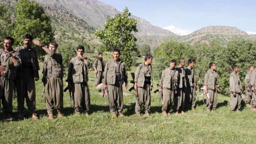 Kurdistan Workers' Party (PKK) rebels gather to listen to the speech of the PKK leader on April 25, 2013 in the Qandil mountain, the PKK headquarters in northern Iraq. Kurdish rebels announced they would on May 8, 2013 begin withdrawing from Turkey into their safe haven in northern Iraq amid a peace drive between Ankara and the rebel movement. AFP PHOTO STR        (Photo credit should read -/AFP/Getty Images)
