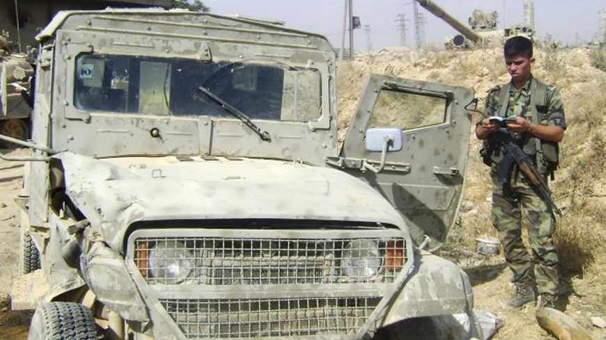 A handout photograph distributed by Syria's national news agency SANA, on May 20,2013, shows a vehicle which it says is an Israeli military vehicle being used by rebel fighters in Qusair near Homs city. Syrian television also showed footage of what it said was an Israeli military Jeep which it said the rebels had been using and which showed the extent of their foreign backing. An Israeli military spokeswoman said the vehicle was decommissioned a decade ago and dismissed the footage as "poor propaganda". SAN