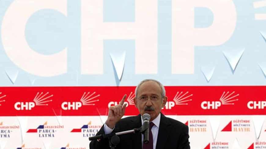 Turkey's main opposition Republican People's Party (CHP) leader Kemal Kilicdaroglu addresses his supporters during a demonstration in Ankara March 27, 2012. Thousands of Turkish opposition supporters demonstrated in the capital Ankara on Tuesday against a government attempt to railroad a new education bill through parliament which secular parties say is designed to promote Islamic schooling. The government wants to overturn a 1997 law imposed with the backing of the military which led to a sharp decrease in