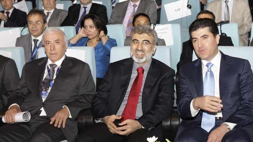 Kuridish Prime Minister Nechirvan Barzani (R), Turkish Energy Minister Taner Yildiz (C) and Kurdistan Regional Government Natural Resources Minister Ashti Hawrami attend the first International Energy Arena in Arbil, about 350 km (217 miles) north of Baghdad, May 20, 2012. Iraq's autonomous Kurdistan region expects to start exporting oil from its fields along a new pipeline to the Turkish border when the line is complete in August 2013, Hawrami said on Sunday.   REUTERS/Azad Lashkari (IRAQ - Tags : - Tags: 