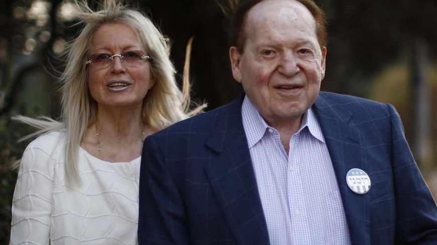 Sheldon Adelson (R), Chairman of Las Vegas Sands Corp, and his wife Miriam are pictured after attending U.S. Republican Presidential candidate Mitt Romney's foreign policy remarks at Mishkenot Sha'ananim in Jerusalem, July 29, 2012.   REUTERS/Jason Reed  (JERUSALEM - Tags: POLITICS BUSINESS) - RTR35LLD