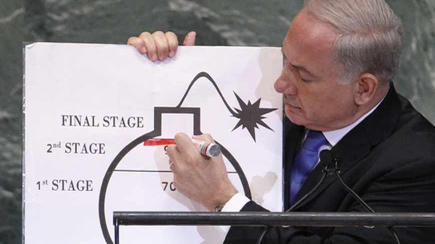 Prime Minister of Israel Benjamin Netanyahu draws a red line on a graphic of a bomb as he addresses the 67th United Nations General Assembly at the U.N. Headquarters in New York, September 27, 2012. REUTERS/Lucas Jackson (UNITED STATES - Tags: POLITICS) - RTR38I5Z