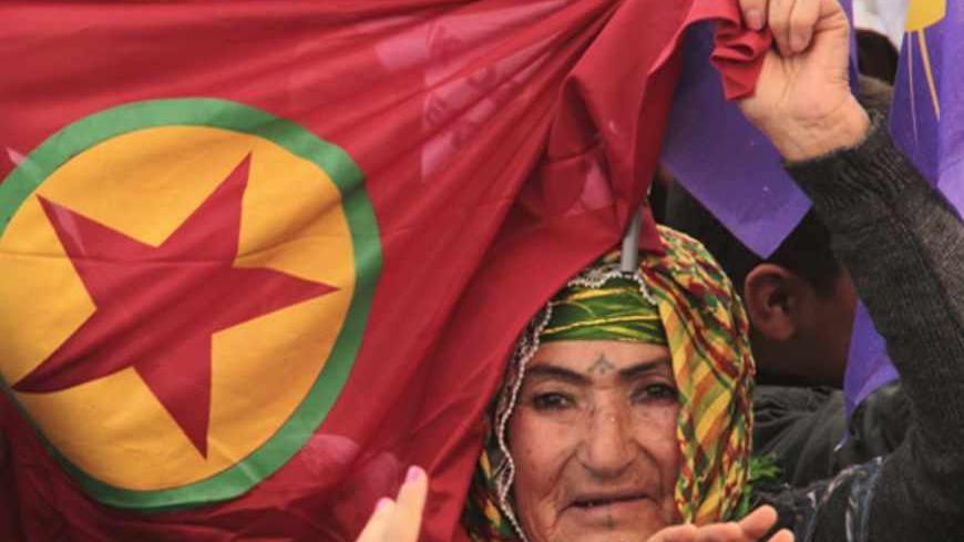 Turkish-Kurdish woman waves a PKK flag during a demonstration in support of Syrian Kurds, in the southeastern Turkish town of Nusaybin, near the Turkish-Syrian border, January, 26, 2013. Sitting across the table from top Turkish officials, jailed Kurdish rebel leader Abdullah Ocalan wields the power to silence guns across southeastern Turkey which have killed more than 40,000 people in a three decade-old insurgency. Reviled by most Turks and held in virtual isolation since his 1999 capture, the Kurdistan Wo