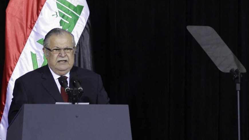 Iraqi President Jalal Talabani (L) speaks next to U.S. Ambassador to Iraq James Jeffrey during one of several planned ceremonies to mark the end of American military presence in Iraq, in Baghdad December 1, 2011. The last 13,000 U.S. troops will pull out of Iraq by the end of the year. Violence in the country has dropped sharply since the heights of sectarian slaughter in 2006-2007, but at least 10 people were killed in a bombing just north of the capital Baghdad. REUTERS/Khalid Mohammed/Pool (IRAQ - Tags: 