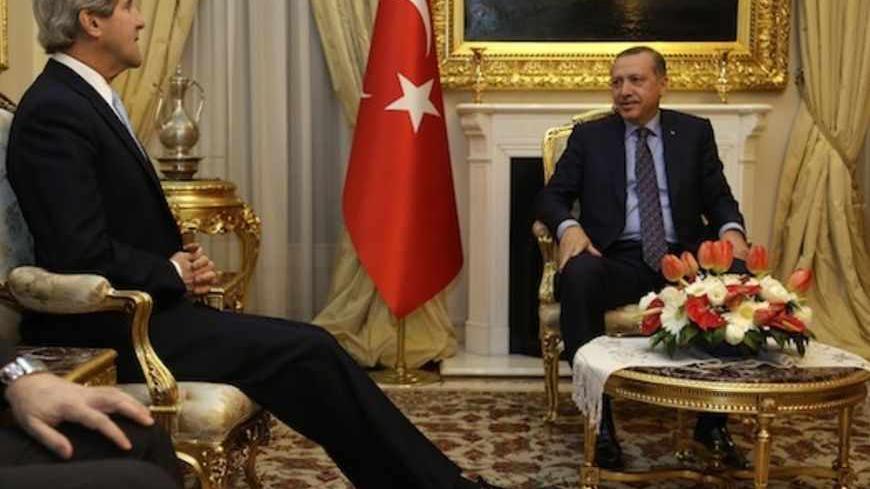 U.S. Secretary of State John Kerry (L) meets with Turkish Prime Minister Tayyip Erdogan at Ankara Palace in Ankara, March 1, 2013. Kerry said on Friday the United States found a comment by Turkey's prime minister, likening Zionism to crimes against humanity, "objectionable", overshadowing their talks on the crisis in neighbouring Syria. REUTERS/Jacquelyn Martin/Pool (TURKEY - Tags: POLITICS) - RTR3EG8P