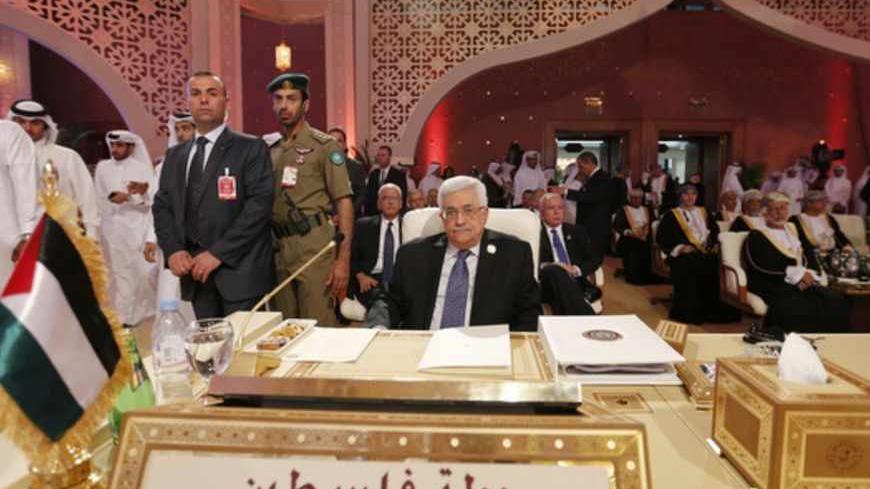Palestinian President Mahmoud Abbas looks on during the opening of the Arab League summit in Doha, Qatar, March 26, 2013. A summit of Arab heads of state opened in the Qatari capital Doha on Tuesday expected to focus on the war in Syria as well as on the Israeli-Palestinian conflict.  REUTERS/Ahmed Jadallah (QATAR - Tags: POLITICS) - RTXXXPW