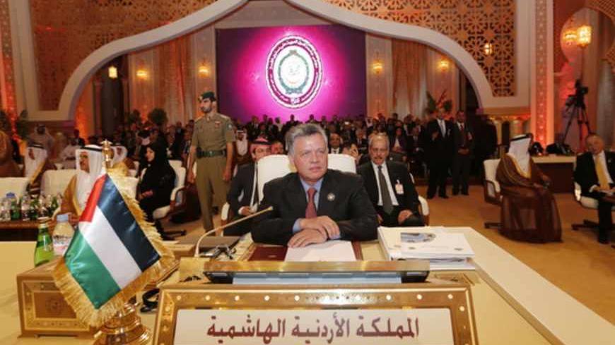 Jordan's King Abdullah looks on during the opening of the Arab League summit in Doha March 26, 2013. A summit of Arab heads of state opened in the Qatari capital Doha on Tuesday expected to focus on the war in Syria as well as on the Israeli-Palestinian conflict.  REUTERS/Ahmed Jadallah (QATAR - Tags: POLITICS ROYALS) - RTXXXQQ