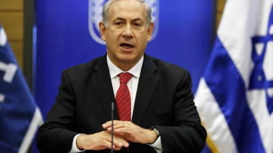 Israel's Prime Minister Benjamin Netanyahu gestures as he speaks during a Likud party meeting at the Knesset, the Israeli parliament, in Jerusalem April 22, 2013. REUTERS/Baz Ratner (JERUSALEM - Tags: POLITICS) - RTXYVXD