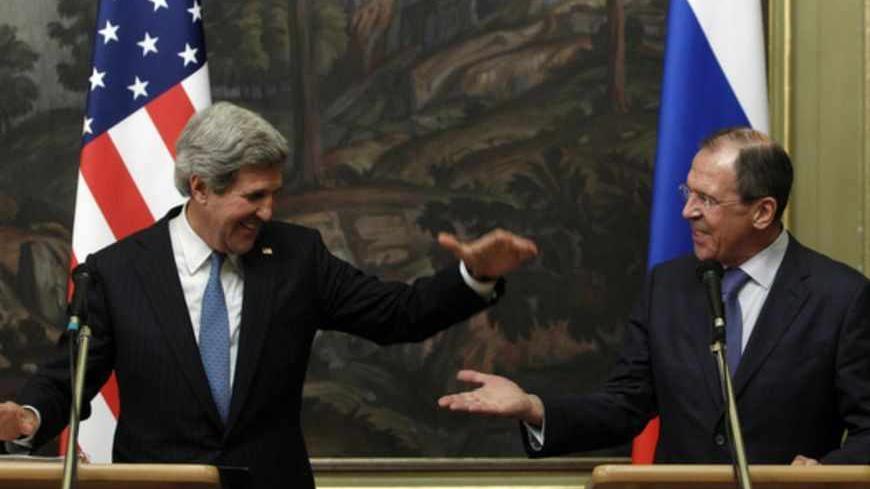 Russia's Foreign Minister Sergei Lavrov (R) and U.S. Secretary of State John Kerry react during a joint news conference after their meeting in Moscow, May 7, 2013. The U.S. secretary of state sought Russian help in ending Syria's civil war on Tuesday, telling President Vladimir Putin in Moscow that common interest in a stable Middle East could bridge divisions among the big powers. REUTERS/Sergei Karpukhin (RUSSIA - Tags: POLITICS CONFLICT TPX IMAGES OF THE DAY) - RTXZE2F