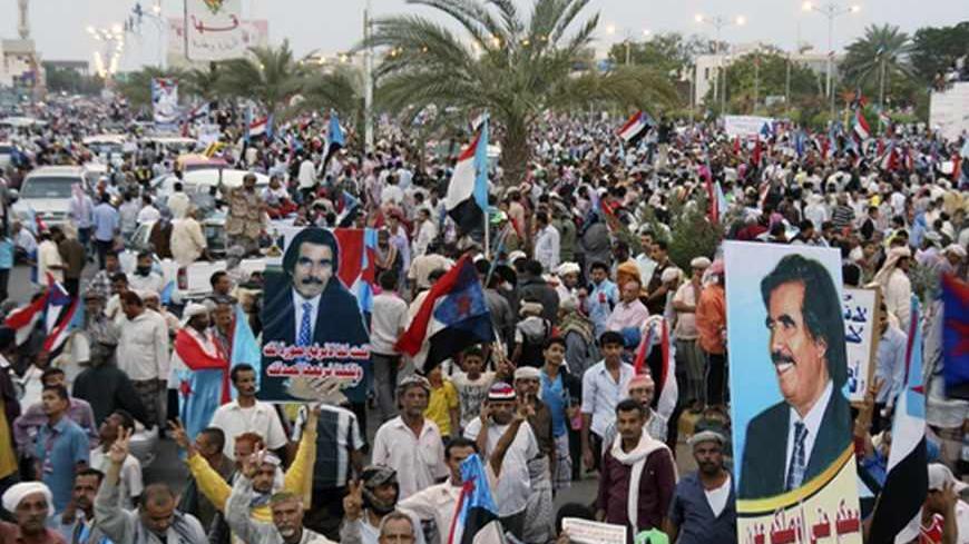 Supporters of Yemen's separatist Southern Movement hold up posters of former president of South Yemen Ali Salem al-Beidh during a rally in the southern port city of Aden January 27, 2013. The rally was held to call for the secession of Yemen's south. REUTERS/Yaser Hasan (YEMEN - Tags: POLITICS CIVIL UNREST) - RTR3D1UU