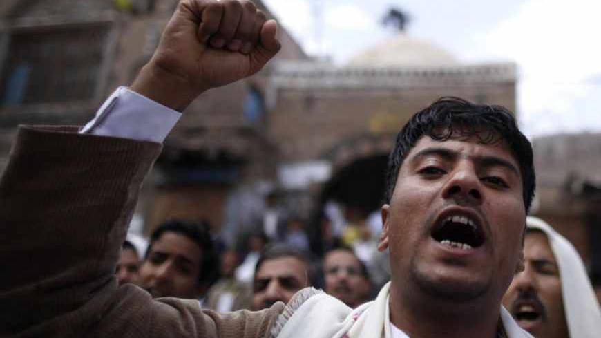 Protesters loyal to the Shi'ite al-Houthi rebel group shout slogans during a demonstration to protest against what they say is U.S. interference in Yemen, including drone strikes, after their weekly Friday prayers in the Old Sanaa city April 12, 2013. REUTERS/Khaled Abdullah (YEMEN - Tags: POLITICS CIVIL UNREST RELIGION) - RTXYIU5