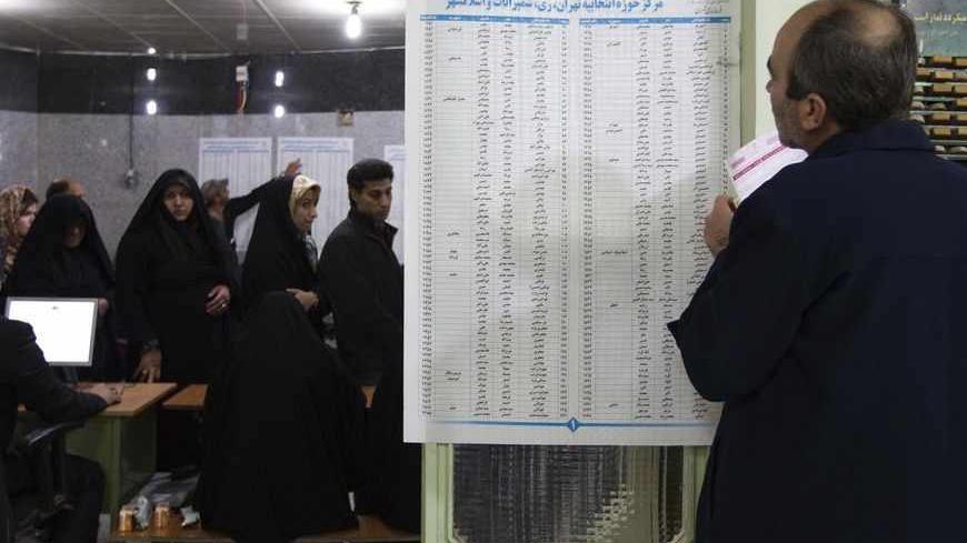 EDITORS' NOTE: Reuters and other foreign media are subject to Iranian restrictions on leaving the office to report, film or take pictures in Tehran.
A man fills in his ballot during Iran's parliamentary election at a mosque in southern Tehran March 2, 2012. Iranians voted on Friday in a parliamentary election likely to reinforce Supreme Leader Ayatollah Ali Khamenei's power over rival hardliners led by President Mahmoud Ahmadinejad.   REUTERS/Raheb Homavandi  (IRAN - Tags: POLITICS ELECTIONS) - RTR2YQMD