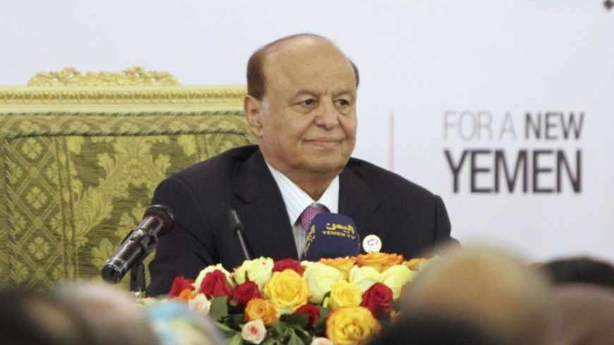 Yemen's President Abd-Rabbu Mansour Hadi smiles during the opening of the second plenary session of the dialogue conference in Sanaa June 8, 2013. REUTERS/Mohamed al-Sayaghi (YEMEN - Tags: POLITICS) - RTX10G6Q