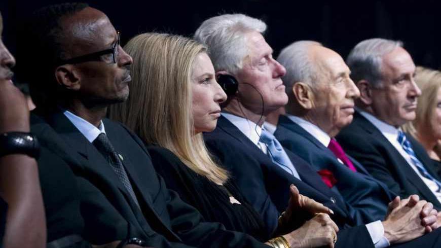 Rwanda President Paul Kagame (2nd L) and his wife Jeannette (L), U.S. singer-actress Barbra Streisand (3rd L), former U.S. President Bill Clinton (4th L) and Israeli Prime Minister Benjamin Netanyahu (2nd R) and his wife Sarah (R) attend celebrations marking Israeli President Shimon Peres' (3rd R) 90th birthday in Jerusalem June 18, 2013. REUTERS/Jim Hollander/Pool (JERUSALEM - Tags: POLITICS ENTERTAINMENT) - RTX10SO1