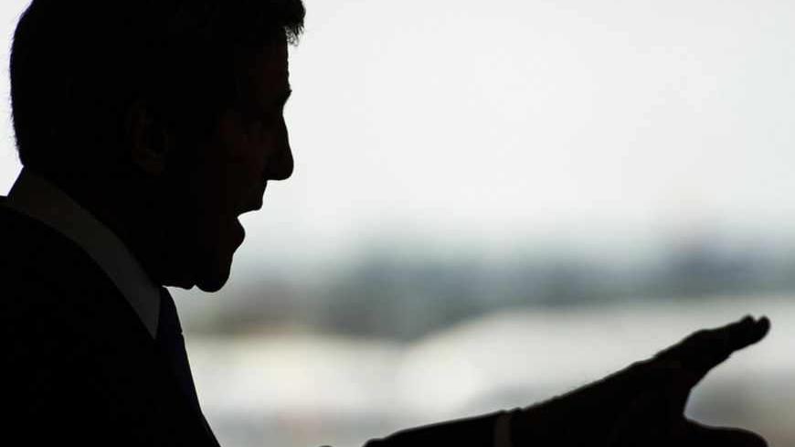 U.S. Secretary of State John Kerry is silhouetted during a news conference at Ben Gurion International Airport near Tel Aviv April 9, 2013. Kerry said on Tuesday he had agreed to work with Israeli and Palestinian leaders to boost economic growth in the occupied West Bank as he seeks ways to revive Middle East peace talks. REUTERS/Paul J. Richards/Pool (JERUSALEM - Tags: POLITICS) - RTXYER1