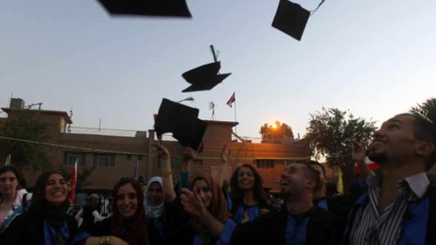 Iraqi students throw their hats duriing their graduation ceremony at Technical University of Baghdad on June 30, 2012 to celebrate receiving their degrees for the first time since the US-led war on Iraq in 2003. The ceremonies were officially stopped by authorities due to the security issues after several attacks and explosions took place at the university since the ousting of former president, Saddam Hussein in 2003. AFP PHOTO/AHMAD AL-RUBAYE        (Photo credit should read AHMAD AL-RUBAYE/AFP/GettyImages