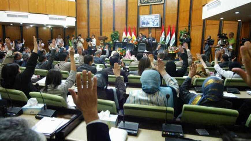 A show of hands takes place during the first session of the Iraqi Kurdish parliament in the northern Kurdish capital of Arbil, 350 kms from Baghdad, on September 08, 2009. A new parliament and president for autonomous Iraqi Kurdish region was voted into place on July 25th with the first full session taking place today.  AFP PHOTO/SAFIN HAMED (Photo credit should read SAFIN HAMED/AFP/Getty Images)
