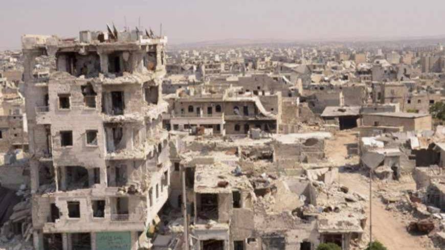 A general view shows damaged buildings at Karm al-Jabal neighborhood of Aleppo, an area controlled by the Free Syrian Army fighters, June 20, 2013.  REUTERS/George Ourfalian (SYRIA - Tags: POLITICS CIVIL UNREST) - RTX10V7U