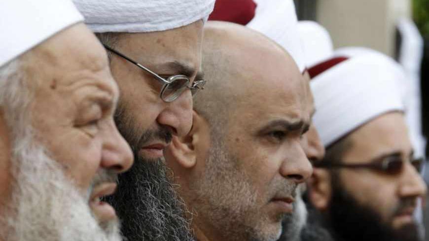 Sunni Muslim Salafist leader Ahmad al-Assir (2nd L) and other Sheikhs take part in a sit-in in Sidon, southern Lebanon, against the killing on Sunday of Sheikh Ahmed Abdul Wahid, a Sunni Muslim cleric, and Muhammed Hussein Miraib, both members of the Lebanon-based March 14 political alliance, May 21, 2012. Lebanese soldiers shot dead two members of an alliance against Syrian President Bashar al-Assad in northern Lebanon on Sunday, security sources said, in the latest incident to raise fears Syria's turmoil 