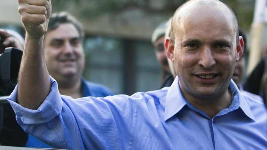 Naftali Bennett, leader of the Bayit Yehudi party, gestures after casting his vote for the parliamentary election at a polling station in Raanana, near Tel Aviv January 22, 2013. Israelis voted on Tuesday in an election widely expected to win Prime Minister Benjamin Netanyahu a third term in office, pushing the Jewish State further to the right, away from peace with Palestinians and towards a showdown with Iran. REUTERS/Nir Elias (ISRAEL - Tags: POLITICS ELECTIONS) - RTR3CS5X