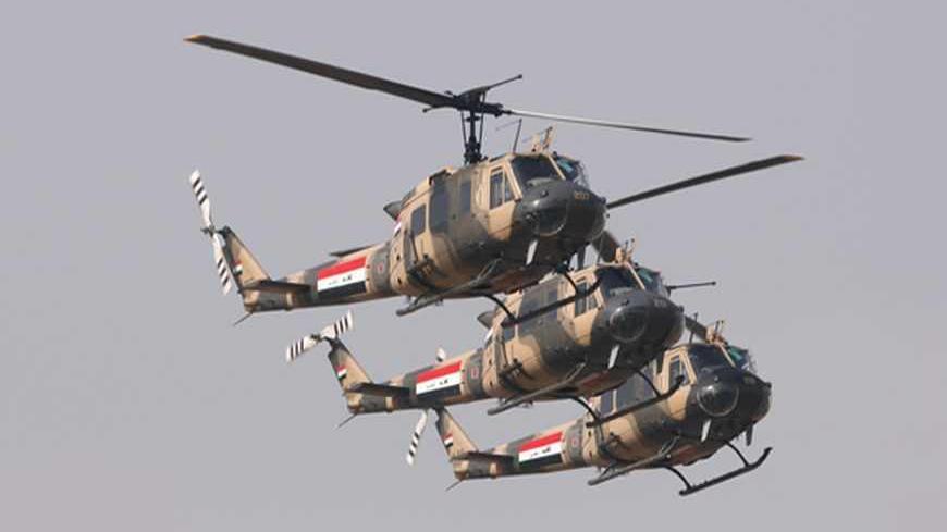 Iraqi Air Force helicopters participate in a flypast ceremony marking the Iraqi Army's 91st anniversary in Baghdad's fortified Green Zone January 6, 2012. REUTERS/Saad Shalash (IRAQ - Tags: MILITARY TRANSPORT ANNIVERSARY) - RTR2VY96