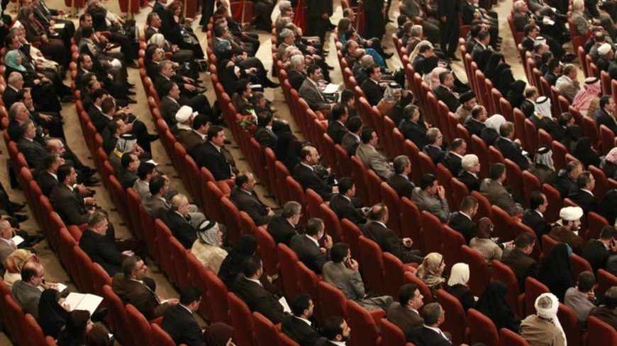 Members of the new Iraqi Parliament attend a session at the Parliament headquarters in Baghdad, November 11, 2010. Iraq's fractious politicians have agreed to return Shi'ite Nuri al-Maliki as prime minister, ending an eight-month deadlock that raised fears of renewed sectarian war, but leaving some Sunnis sceptical he can forge national unity. The pact on top government posts brings together Shi'ites, Sunnis and Kurds in a power-sharing arrangement similar to the last Iraqi government and could help prevent